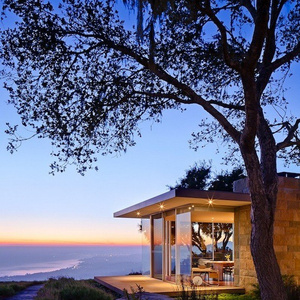 A small house by the sea with a beautiful garden.