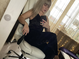 Black velour jumpsuit and long stilettos