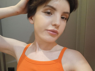 sexy Flora, in a colorful top