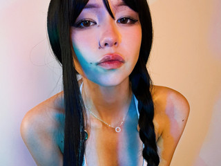 In a skirt and white bra