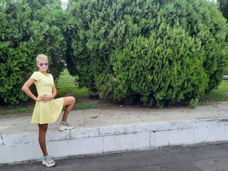 She was walking in a yellow dress