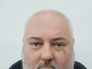 Against the background of a white wall