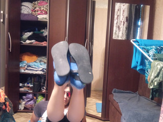 in cycling shorts, sandals and a T-shirt