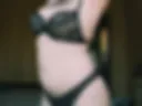 Black lingerie, red stockings