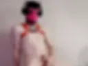 Naked masked puppy posing on hi***nees