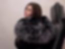 In a fur coat