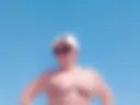 I am sunbathing naked on the beach July 2025