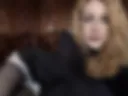 In a maid costume, blonde...