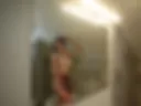 Dressed cam girl in student outfit taking shower
