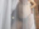 Sexy naked breasts behind the curtain 