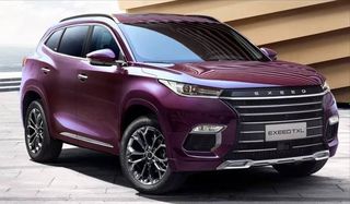 The car is red or pink)