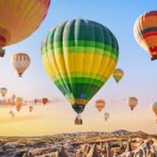 Fly in a hot air balloon)